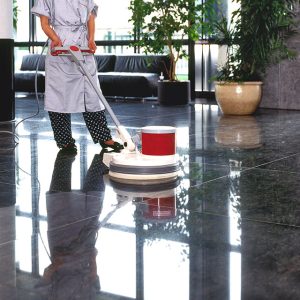 adult cleaner maid woman with uniform cleaning floor in office